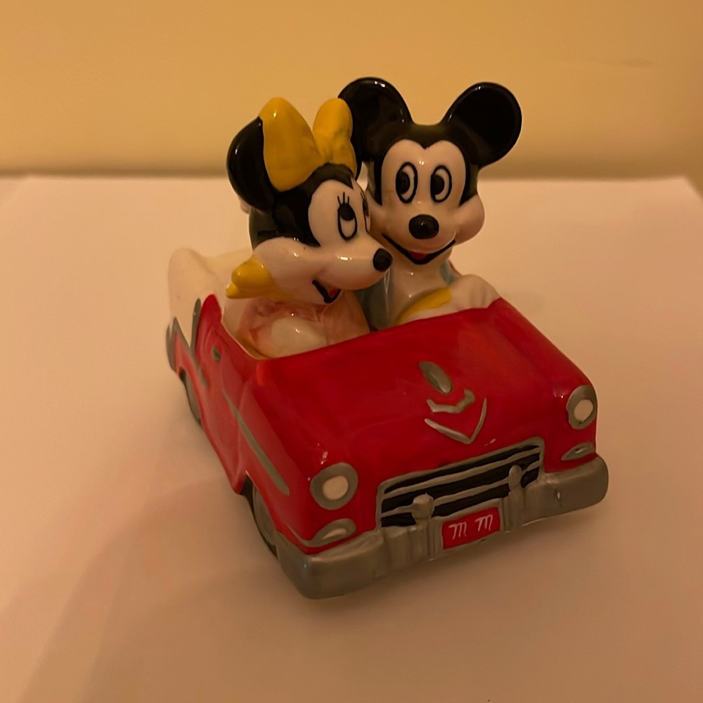 Mickey and Minnie in a car.